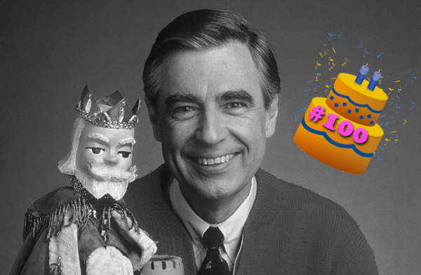Fred Rogers and a 100th anniversary cake over his shoulder